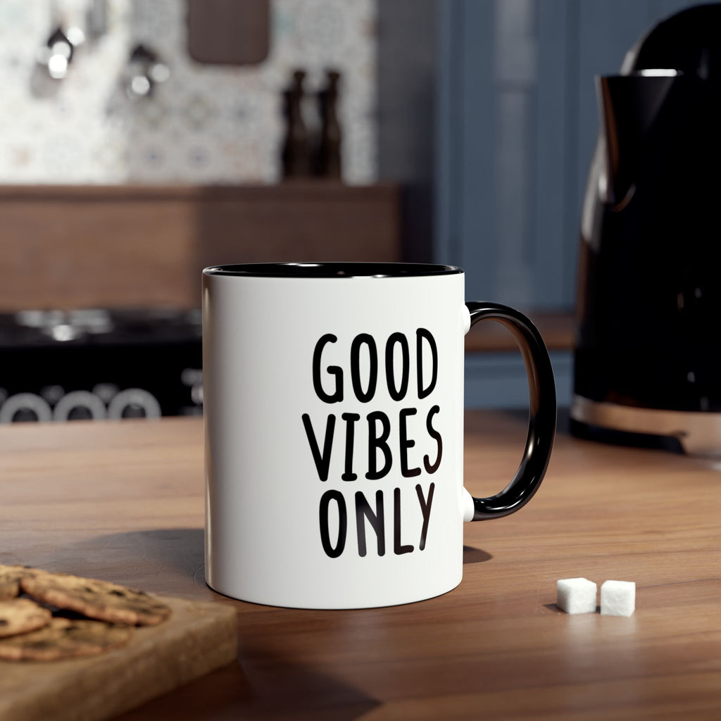 Mug with 'Good Vibes Only' text on a kitchen counter