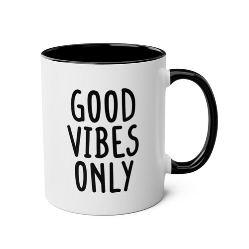 White mug with black interior and handle, featuring 'Good Vibes Only' text on a white background