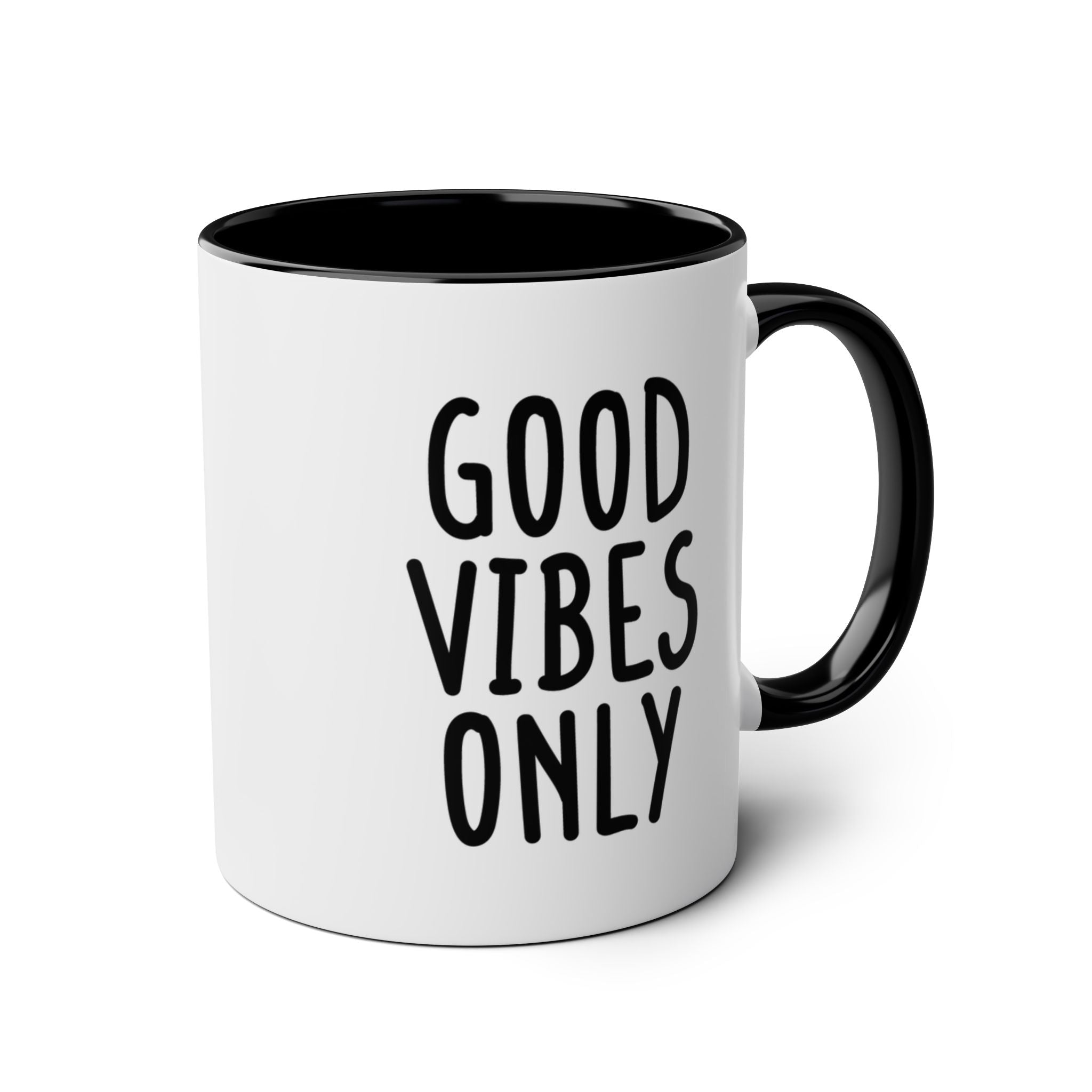 White mug with black interior and handle, featuring 'Good Vibes Only' text on a white background